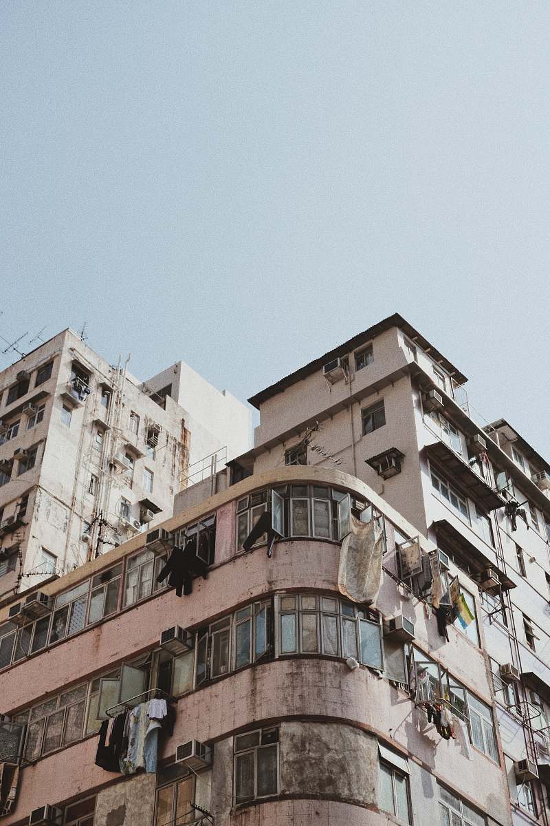 high rise white concrete building during daytime urban